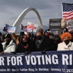 Hundreds of Americans marched across Frederick Douglass Bridge to mark MLK Day