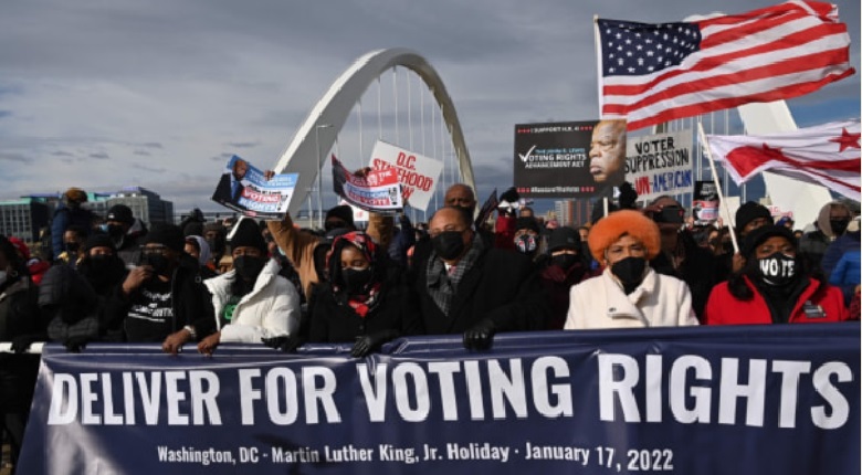 Hundreds of Americans marched across Frederick Douglass Bridge to mark MLK Day